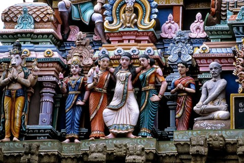 Stucco work portraying a woman about to deliver a baby in standing posture, Mallikeswarar temple in