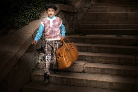 Exterior stairs and child with vintage bag. Vintage clothes style