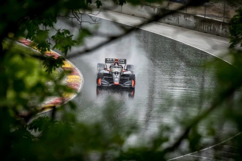 SANTINO FERRUCCI (14) of Woodbury, Connecticut comes through turn 12 (Canada Corner) during a wet