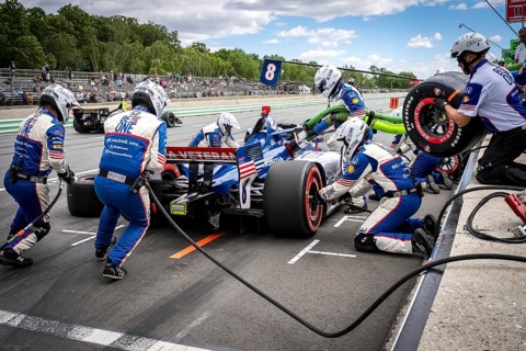 LINUS LUNDQVIST (R) (8) of Stockholm, Sweden comes down pit road for service during the XPEL Grand