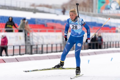 Sportswoman biathlete Petrunova Kseniya Kamchatka Region skiing on distance biathlon stadium. Open