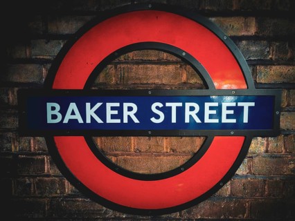 The iconic round sign of Baker Street Underground Station on a brick wall Baker Street Underground