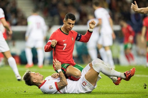 Football match, captain Cristiano RONALDO CR7 Portugal kneeling on the stomach and partly on the