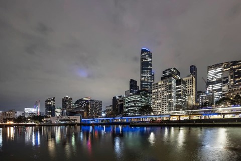 MELBOURNE, AUSTRALIA - JULY 5, 2024: Melbourne skyline as seen at dusk from Queens Bridge near