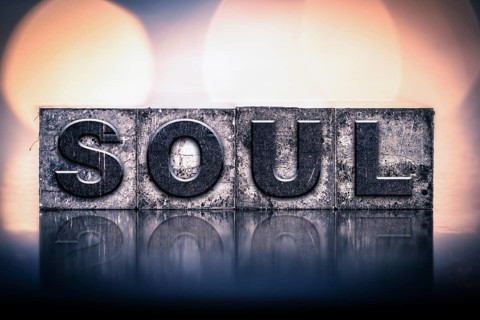 The word SOUL written in vintage ink stained letterpress type