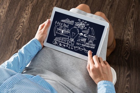 Close-up, the business lady with the tablet. Concept of business planning