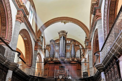 Oaxaca, Mexico, Central America, Baroque organ in a church with richly decorated pipes and wooden