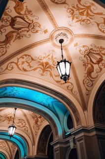 Low angle view of chandelier National Odessa National Academic Opera and Ballet Theatre at night.