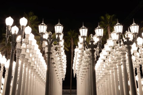 A picture of Urban Light, a public art designed by Chris Burden and unveiled in 2008, next to the