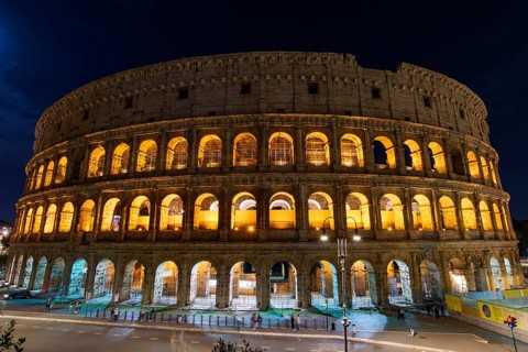 Colosseum at night, an oval amphitheatre and the most popular tourist attraction in Rome, Italy