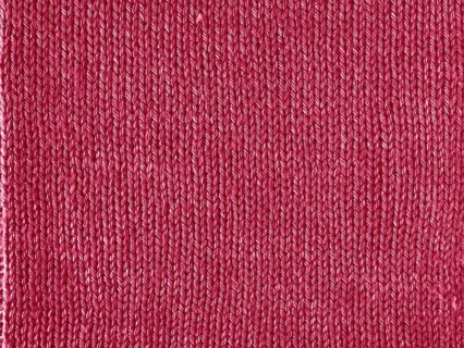 Viva Magenta color knitted Jersey as textile background. Knitted Red Magenta texture. Color of the