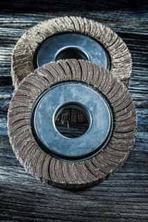Used grinding wheels on vintage wooden board