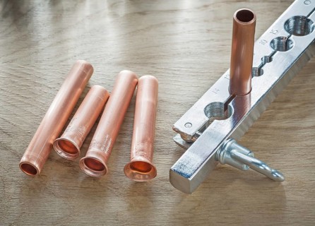 Flared pipes brake plumber on wooden board