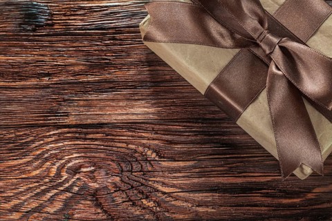Brown gift box on vintage wooden board