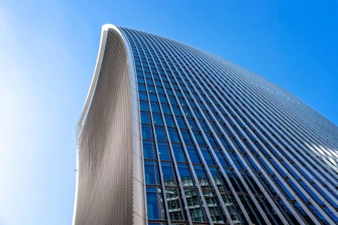 London, UK, May 14, 2019: Low angle view of 20 Fenchurch skyscraper in London agaisnt blue sky.