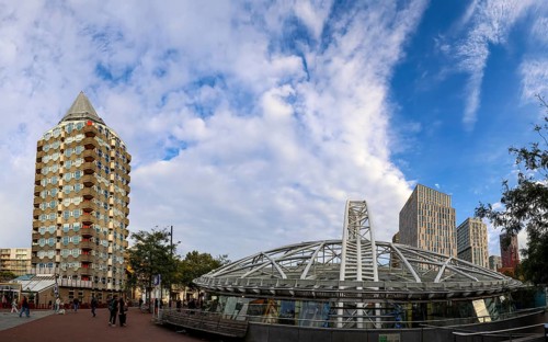 Skyscraper pencil tower and modern metal construction of Rotterdam Blaak metro station, Rotterdam,
