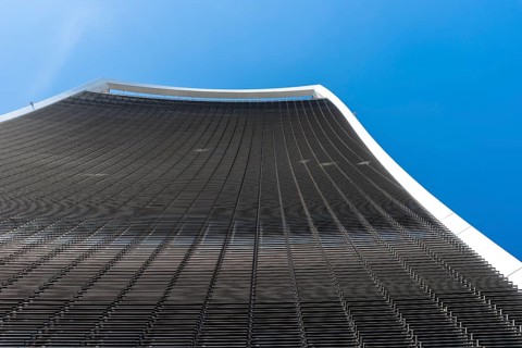 London, UK, May 14, 2019: Low angle view of 20 Fenchurch skyscraper in London agaisnt blue sky.