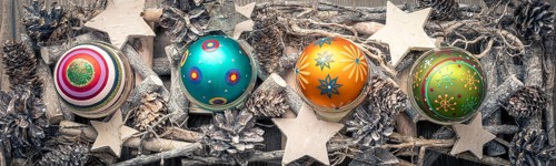 An image of a christmas decoration banner with colored christmas glass balls