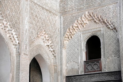 Fes, Northern Morocco, Morocco, Richly decorated wall with detailed patterns and a small window