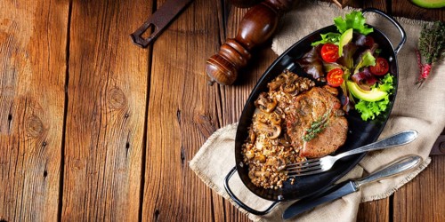 Pork steak with mushrooms and buckwheat groats and mango salad