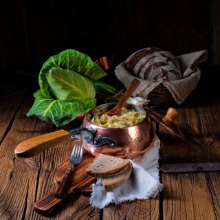 Young and fresh cabbage cooked with bacon cubes