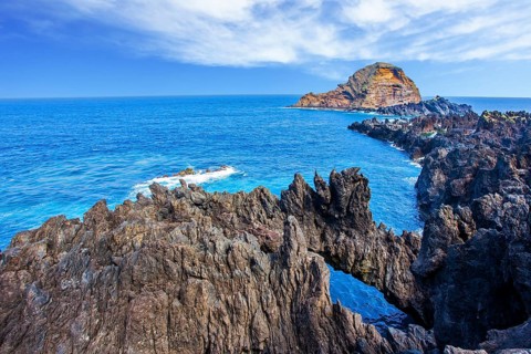 Volcanic island of Madeira. Fantastically beautiful coast. Rocks and grottoes of the Atlantic coast