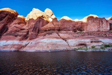 The Colorado River and Antelope Canyon. Grandiose cliffs - red sandstone outcroppings. Tour on a