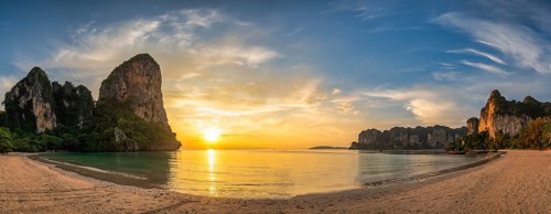 Tropical islands sunset view with ocean sea water and sand beach at Railay Beach, Krabi Thailand