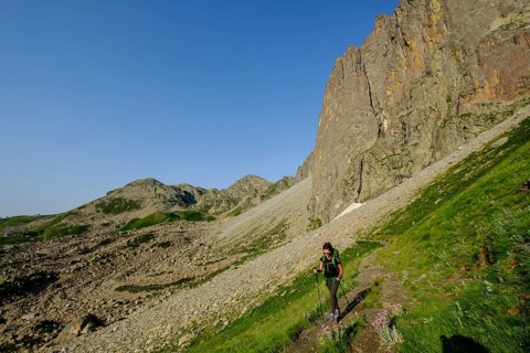 Hiker on the road, Midi d'Ossau peak, 2884 meters, Pyrenees National Park, Pyrenees Atlantiques,