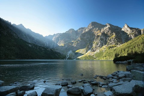 High peaks of the Tatra Mountains on the edge of the lake, Poland