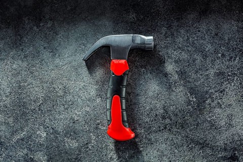 Black Little Claw Hammer On Dark Grey Background