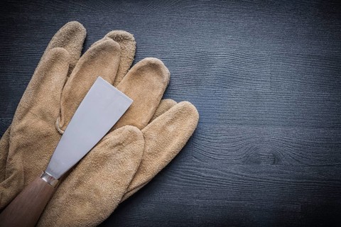 Paint scraper with wood handle and working gloves