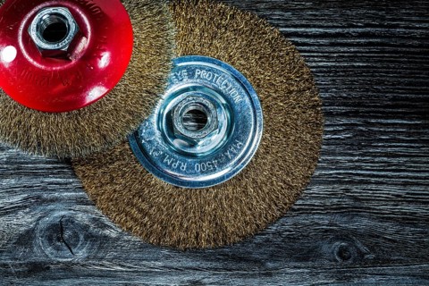 Wire wheel brushes on vintage wooden board