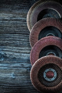 Rotary grinding discs on wooden board