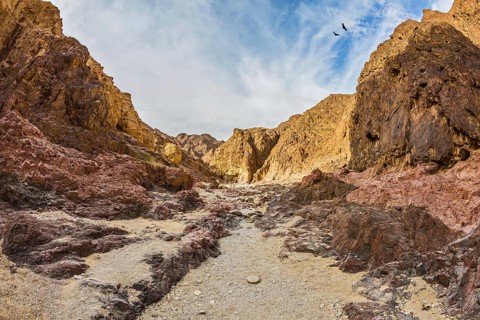 Israel in January. Multicolor and picturesque Black canyon in ancient mountains of Eilat