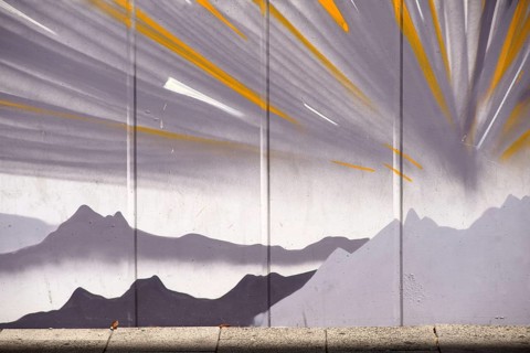 Frankfurt, Germany - August 11, 2018: The drawing of mountains and stylised sunbeams by an unknown