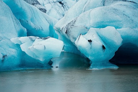 Detailed close-up of blue icebergs showcasing cracks and textures, iceberg, glacier, snow, ice