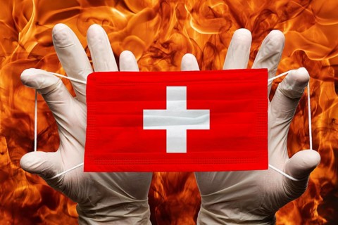 Doctor holding in white gloves protection medical face mask, respiratory bandage with Switzerland