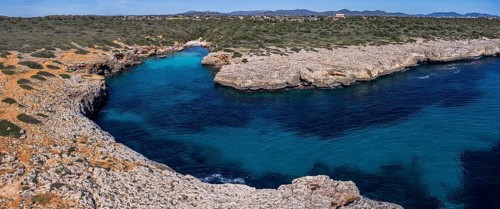 Turquoise waters in Cala Petita, Porto Cristo, coast of Manacor, Majorca, Balearic Islands, Spain