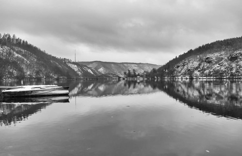 Single track railway bridge over the Vltava river, Czech Republic . Winter landscape