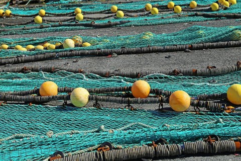 Fishing nets in the port of Loctudy, Finistere, Brittany, France spreading for drying Fishing nets