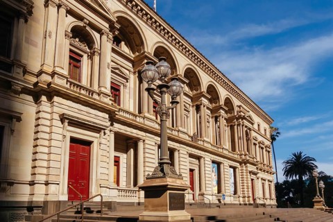 MELBOURNE, AUSTRALIA - JANUARY 8 2025: Old Treasury Building on a hot summer's afternoon in