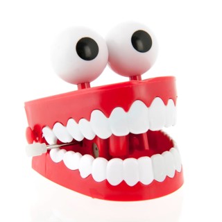 Funny denture with eyes isolated over white background