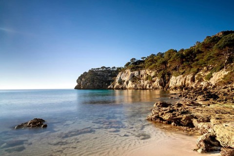 A landscape view of the idyllic Cala Macarella in southern Menorca