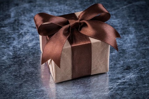 Gift box on scratched metallic background holidays concept