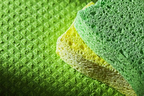 Cleaning kitchen sponges on dishcloth