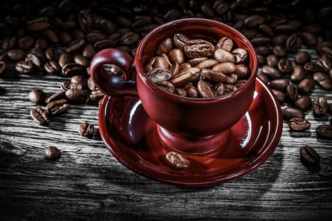 Coffee grains cup saucer on wooden board