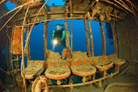 Divers in the washroom of the destroyer USS Lamson, Marshall Islands, Bikini Atoll, Micronesia,