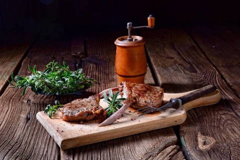 Grilled lamb chops on an old board