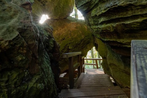Narrow pass with rock holes, Mullerthal Trail, hiking trail near Berdorf, Luxembourg